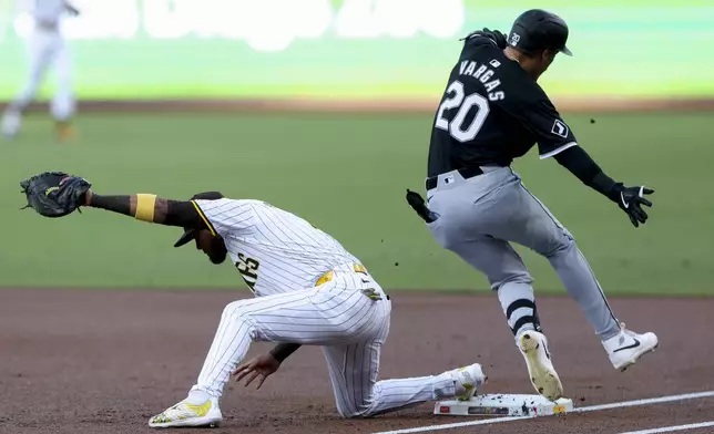 San Diego Padres first baseman Luis Arraez, left, forces out Chicago White Sox's Miguel Vargas during the first inning of a baseball game, Saturday, Sept. 21, 2024, in San Diego. (AP Photo/Ryan Sun)