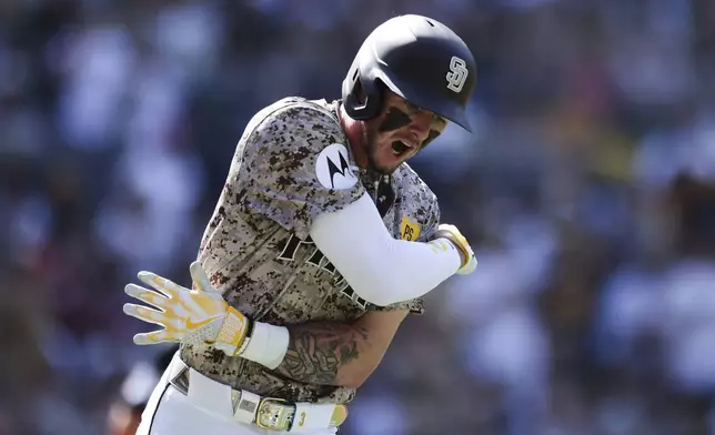 San Diego Padres' Jackson Merrill reacts after flying out to right field in the seventh inning of a baseball game against the Chicago White Sox, Sunday, Sept. 22, 2024, in San Diego. (AP Photo/Derrick Tuskan)