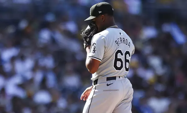 Chicago White Sox relief pitcher Prelander Berroa covers his face after being relieved in the eighth inning of a baseball game against the San Diego Padres, Sunday, Sept. 22, 2024, in San Diego. (AP Photo/Derrick Tuskan)