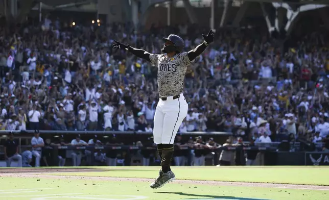 San Diego Padres' Fernando Tatis Jr. celebrates after hitting a solo home run against the Chicago White Sox in the eighth inning of a baseball game Sunday, Sept. 22, 2024, in San Diego. (AP Photo/Derrick Tuskan)