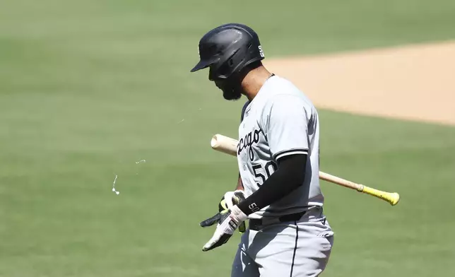 Chicago White Sox' Lenyn Sosa walks back to the dugout after striking out against the San Diego Padres in the second inning of a baseball game, Sunday, Sept. 22, 2024, in San Diego. (AP Photo/Derrick Tuskan)