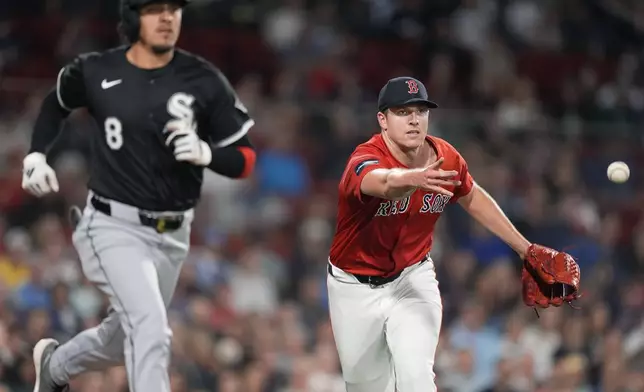 Boston Red Sox starting pitcher Nick Pivetta tosses to first base on the ground out by Chicago White Sox's Nicky Lopez (8) during the second inning of a baseball game, Friday, Sept. 6, 2024, in Boston. (AP Photo/Michael Dwyer)