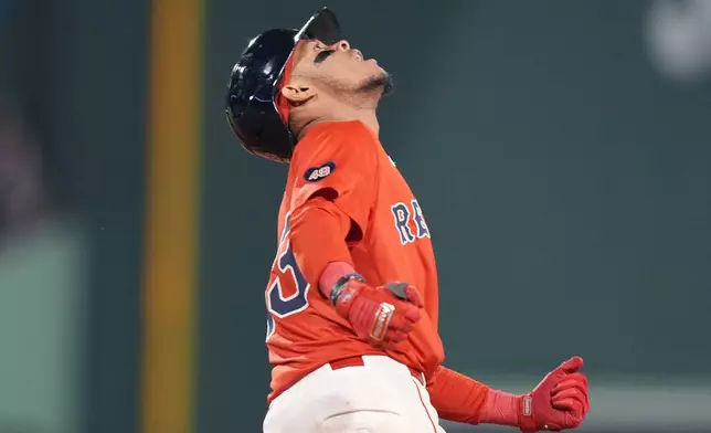 Boston Red Sox's Ceddanne Rafaela reacts as he rounds the bases on his two-run home run during the seventh inning of a baseball game against the Chicago White Sox, Friday, Sept. 6, 2024, in Boston. (AP Photo/Michael Dwyer)