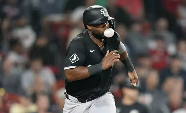 Chicago White Sox's Chuckie Robinson runs on his single during the fourth inning of a baseball game against the Boston Red Sox, Friday, Sept. 6, 2024, in Boston. (AP Photo/Michael Dwyer)