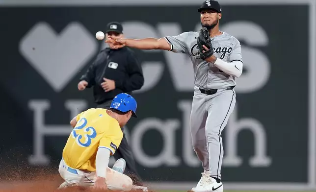 Boston Red Sox's Romy Gonzalez (23) is forced out at second as Chicago White Sox second baseman Lenyn Sosa, right, turns a double play against Connor Wong during the fifth inning of a baseball game, Saturday, Sept. 7, 2024, in Boston. (AP Photo/Michael Dwyer)