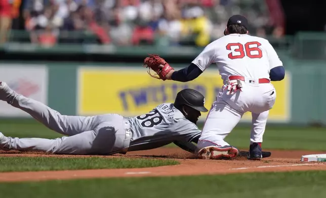 Chicago White Sox's Luis Robert Jr. (88) is picked off at first as Boston Red Sox first baseman Triston Casas (36) tags him in the first inning of a baseball game, Sunday, Sept. 8, 2024, in Boston. (AP Photo/Steven Senne)