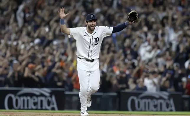 Detroit Tigers' Matt Vierling celebrates after defeating the Chicago White Sox to get into the playoffs in a baseball game, Friday, Sept. 27, 2024, in Detroit. (AP Photo/Duane Burleson)