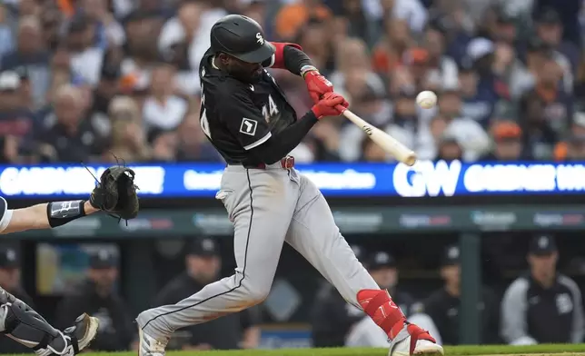 Chicago White Sox's Bryan Ramos hits a two-run single against the Detroit Tigers in the seventh inning of a baseball game, Sunday, Sept. 29, 2024, in Detroit. (AP Photo/Paul Sancya)