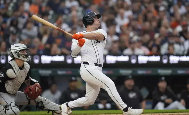 Detroit Tigers' Kerry Carpenter hits a grand slam against the Chicago White Sox in the fifth inning of a baseball game, Sunday, Sept. 29, 2024, in Detroit. (AP Photo/Paul Sancya)