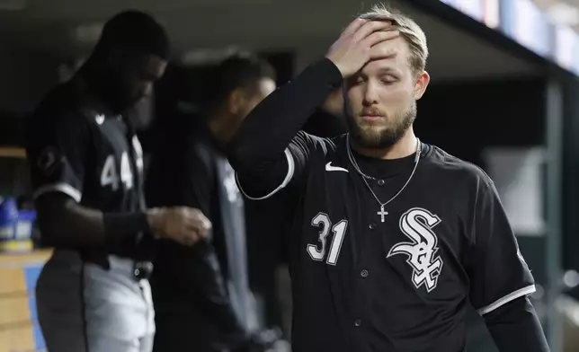 Chicago White Sox's Zach DeLoach (31) walks through the dugout during the ninth inning of a loss to the Detroit Tigers in a baseball game Friday, Sept. 27, 2024, in Detroit. (AP Photo/Duane Burleson)