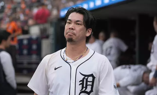 Detroit Tigers pitcher Kenta Maeda (18) walks in the dugout against the Chicago White Sox in the third inning of a baseball game, Sunday, Sept. 29, 2024, in Detroit. (AP Photo/Paul Sancya)