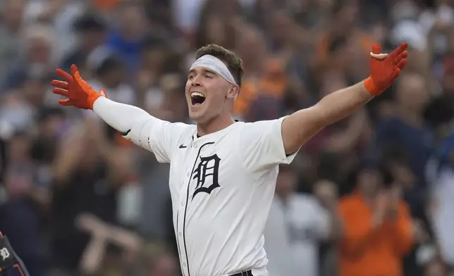 Detroit Tigers' Kerry Carpenter celebrates his grand slam against the Chicago White Sox in the fifth inning of a baseball game, Sunday, Sept. 29, 2024, in Detroit. (AP Photo/Paul Sancya)