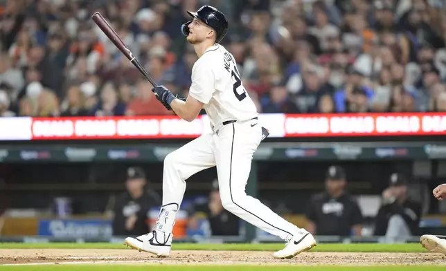 Detroit Tigers outfielder Parker Meadows connects for a single during the fifth inning of a baseball game against the Chicago White Sox, Friday, Sept. 27, 2024, in Detroit. (AP Photo/Carlos Osorio)