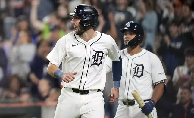 Detroit Tigers' Matt Vierling reacts after scoring during the seventh inning of a baseball game against the Chicago White Sox, Friday, Sept. 27, 2024, in Detroit. (AP Photo/Carlos Osorio)