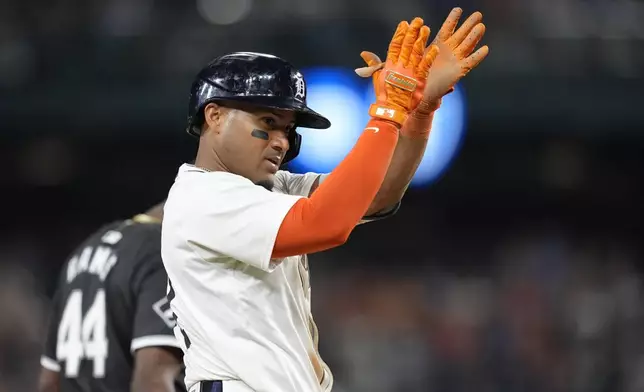 Detroit Tigers' Andy Ibáñez reacts after reaching third during the seventh inning of a baseball game against the Chicago White Sox, Friday, Sept. 27, 2024, in Detroit. (AP Photo/Carlos Osorio)