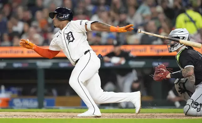 Detroit Tigers' Andy Ibáñez doubles during the seventh inning of a baseball game against the Chicago White Sox, Friday, Sept. 27, 2024, in Detroit. (AP Photo/Carlos Osorio)