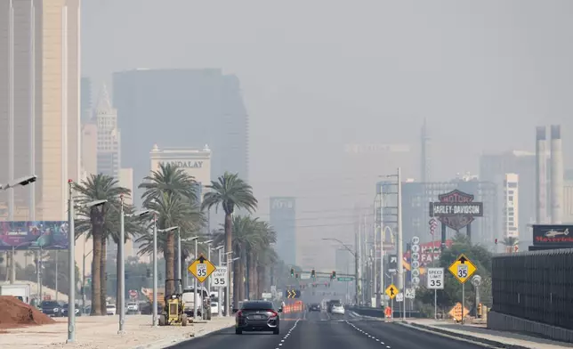 Smoke from California wildfires obscures the view of casinos northbound on the Las Vegas Strip in Las Vegas, Nev., Wednesday, Sept. 11, 2024. (Steve Marcus/Las Vegas Sun via AP)