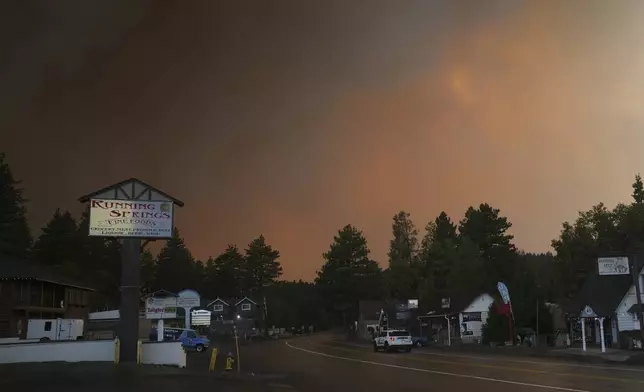 FILE - Smoke from the Line Fire fills the air Saturday, Sept. 7, 2024, in Running Springs, Calif. (AP Photo/Eric Thayer, File)