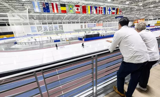 International Olympic Committee President Thomas Bach, far right, checks out the Utah Hockey Club's facilities with Chris Armstrong, president of hockey operations for the Utah Hockey Club, at the Utah Olympic Oval in Kearns, Utah, Saturday, Sept. 28. 2024. (Isaac Hale/The Deseret News via AP)