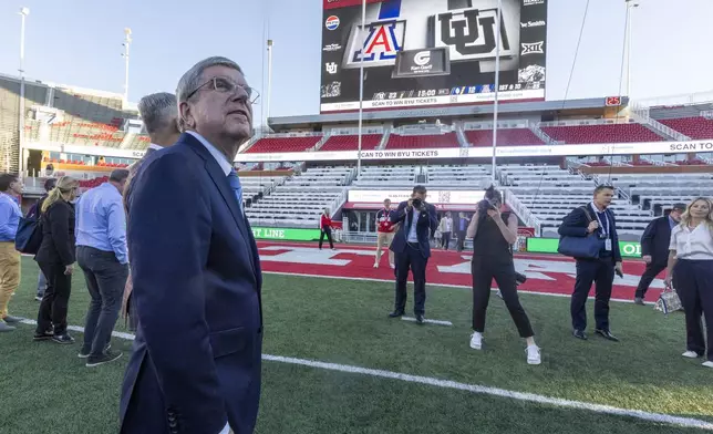 International Olympic Committee President Thomas Bach tours University of Utah's Rice-Eccles Stadium as he leads a delegation visiting ahead of the 2034 Winter Olympics, on the campus of the university in Salt Lake City on Friday, Sept. 27, 2024. (Brice Tucker/The Deseret News via AP)