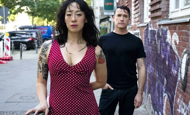 Angela Seo, left, and Jamie Stewart of the band Xiu Xiu pose for a portrait in Berlin, Germany, Wednesday, Aug. 28, 2024. (AP Photo/Markus Schreiber)