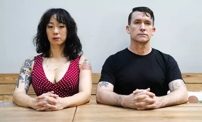 Angela Seo, left, and Jamie Stewart of the band Xiu Xiu pose for a portrait in Berlin, Germany, Wednesday, Aug. 28, 2024. (AP Photo/Markus Schreiber)