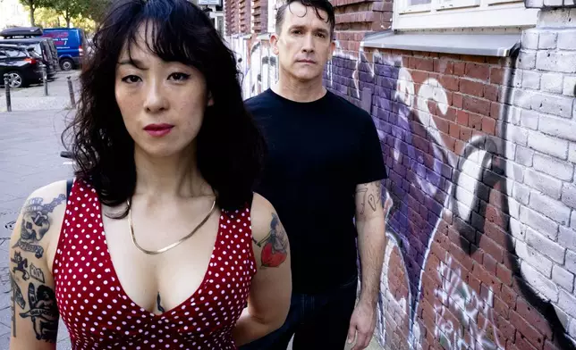 Angela Seo, left, and Jamie Stewart of the band Xiu Xiu pose for a portrait in Berlin, Germany, Wednesday, Aug. 28, 2024. (AP Photo/Markus Schreiber)