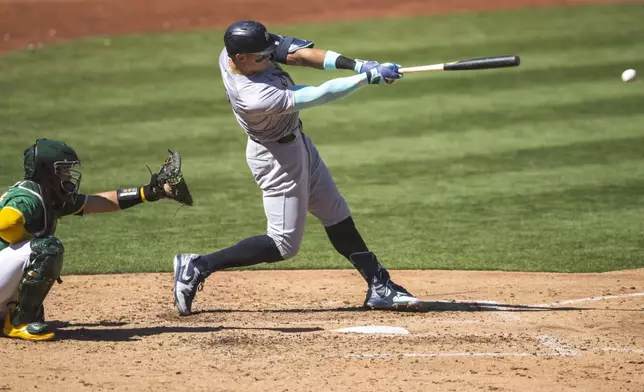 New York Yankees' Aaron Judge hits during the fifth inning of a baseball game against the Oakland Athletics in Oakland, Calif., Sunday, Sept. 22, 2024. (AP Photo/Nic Coury)