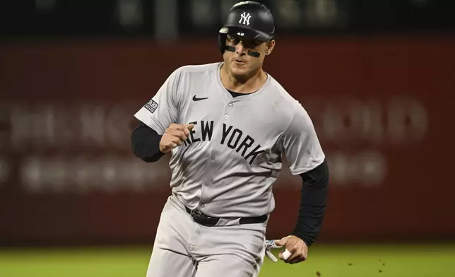 New York Yankees' Anthony Rizzo runs to third base during the fifth inning of a baseball game against the Oakland Athletics, Friday, Sept. 20, 2024, in Oakland, Calif. (AP Photo/Eakin Howard)