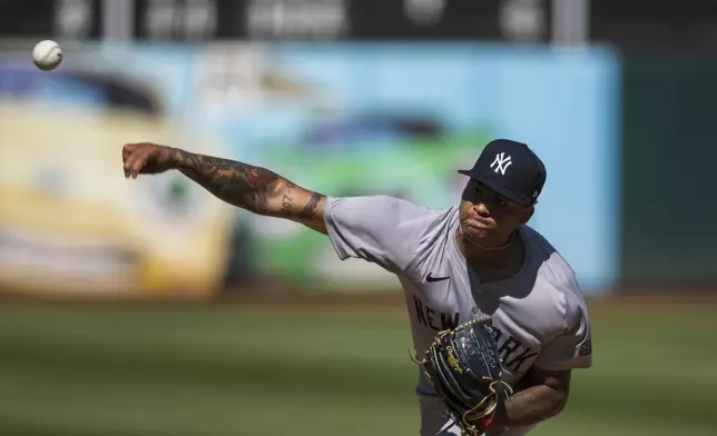 New York Yankees pitcher Luis Gil throws during the fifth inning of a baseball game against the Oakland Athletics in Oakland, Calif., Sunday, Sept. 22, 2024. (AP Photo/Nic Coury)