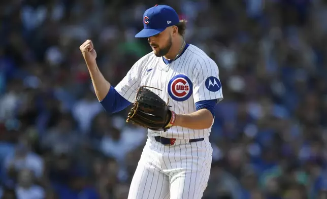 Chicago Cubs closing pitcher Porter Hodge celebrates after defeating the New York Yankees 2-1 in a baseball game in Chicago, Sunday, Sept. 8, 2024. (AP Photo/Paul Beaty)