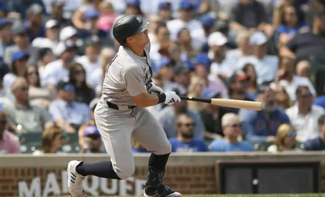 New York Yankees' Anthony Volpe watches his RBI sacrifice fly during the second inning of a baseball game against the Chicago Cubs in Chicago, Sunday, Sept. 8, 2024. (AP Photo/Paul Beaty)