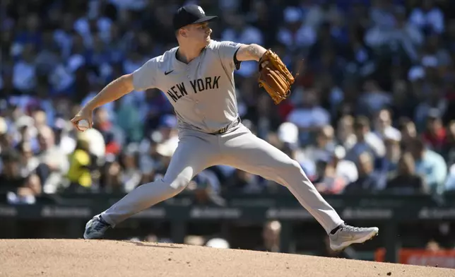 New York Yankees starter Clarke Schmidt delivers a pitch during the first inning of a baseball game against the Chicago Cubs in Chicago, Saturday, Sept. 7, 2024. (AP Photo/Paul Beaty)