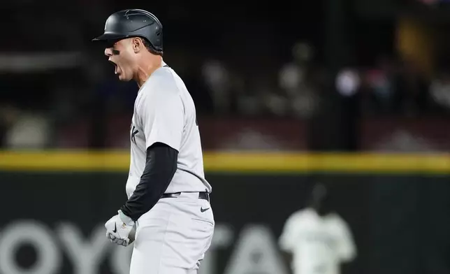 New York Yankees' Anthony Rizzo reacts after hitting an RBI double against the Seattle Mariners during the 10th inning of a baseball game Wednesday, Sept. 18, 2024, in Seattle. (AP Photo/Lindsey Wasson)