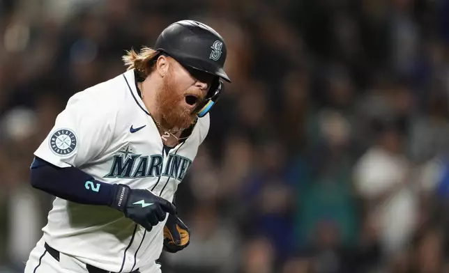 Seattle Mariners' Justin Turner reacts to hitting a solo home run against the New York Yankees during the eighth inning of a baseball game Wednesday, Sept. 18, 2024, in Seattle. (AP Photo/Lindsey Wasson)