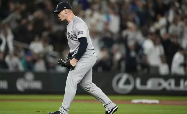 New York Yankees relief pitcher Ian Hamilton reacts to earning the save in a 2-1 win over the Seattle Mariners in a baseball game Wednesday, Sept. 18, 2024, in Seattle. (AP Photo/Lindsey Wasson)