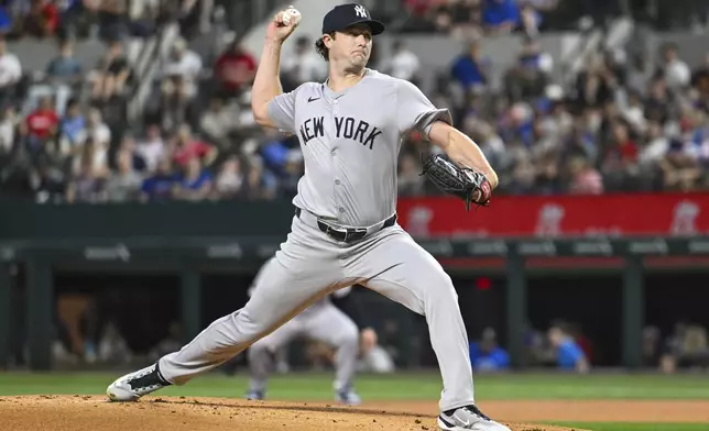 New York Yankees starting pitcher Gerrit Cole throws to the Texas Rangers in the first inning of a baseball game, Monday, Sept. 2, 2024, in Arlington, Texas. (AP Photo/Albert Pena)