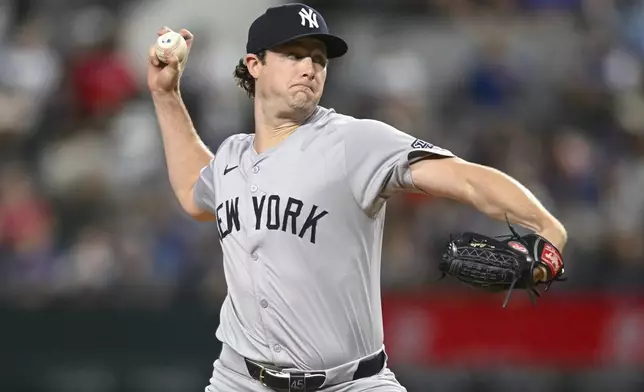 New York Yankees starting pitcher Gerrit Cole throws to the Texas Rangers in the first inning of a baseball game, Monday, Sept. 2, 2024, in Arlington, Texas. (AP Photo/Albert Pena)