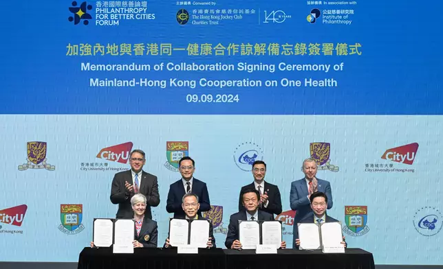 The Memorandum of Collaboration was signed by Li Qun, Deputy Director General, Chinese Center for Disease Control and Prevention (front row, 2nd right); Prof Chak-sing Lau, Dean of Medicine, The University of Hong Kong (front row, 2nd left); Prof Philip Chiu Wai-yan, Dean of Medicine, The Chinese University of Hong Kong (front row, 1st right); and Prof Vanessa Barrs, Dean, Jockey Club College of Veterinary Medicine and Life Sciences, City University of Hong Kong (front row, 1st left). The signing ceremony was witnessed by Michael Lee,Chairman of The Hong Kong Jockey Club (back row, 2nd right); Lester Huang, Chairman of IoP and Steward of The Hong Kong Jockey Club (back row, 1st left); Winfried Engelbrecht Bresges, CEO of The Hong Kong Jockey Club and Director of IoP (back row, 1st right); and Dr Ronald Lam, Director of Health, HKSAR Government (back row, 2nd left).