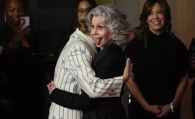 Kate Winslet, left, and Jane Fonda embrace during the Women in Film Honors on Thursday, Oct. 23, 2024, at The Beverly Hilton in Beverly Hills, Calif. (AP Photo/Chris Pizzello)