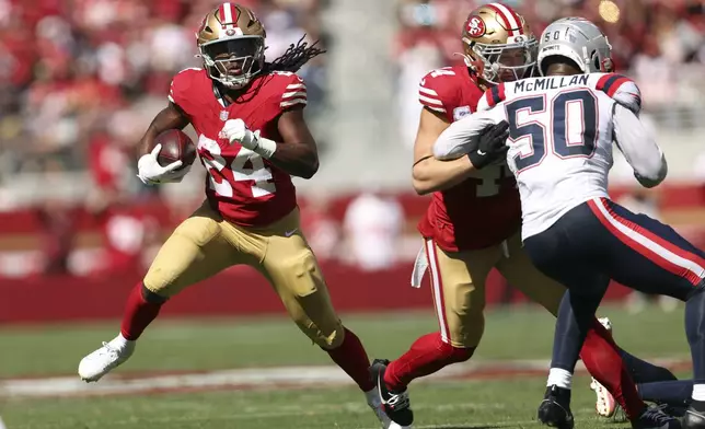 San Francisco 49ers' Jordan Mason rushes during an NFL football game against the New England Patriots in Santa Clara, Calif., Sunday, Sept. 29, 2024. (Scott Strazzante/San Francisco Chronicle via AP)