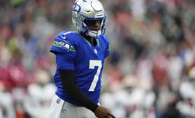 Seattle Seahawks quarterback Geno Smith walks off the field during the first half of an NFL football game against the San Francisco 49ers, Thursday, Oct. 10, 2024, in Seattle. (AP Photo/Lindsey Wasson)