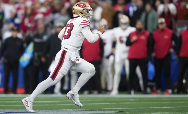 San Francisco 49ers quarterback Brock Purdy (13) nuns during the first half of an NFL football game against the Seattle Seahawks, Thursday, Oct. 10, 2024, in Seattle. (AP Photo/Lindsey Wasson)