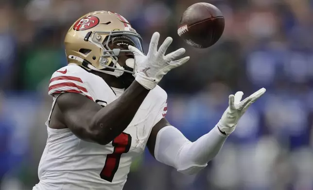 San Francisco 49ers wide receiver Deebo Samuel Sr. males catch during the first half of an NFL football game against the Seattle Seahawks, Thursday, Oct. 10, 2024, in Seattle. (AP Photo/John Froschauer)