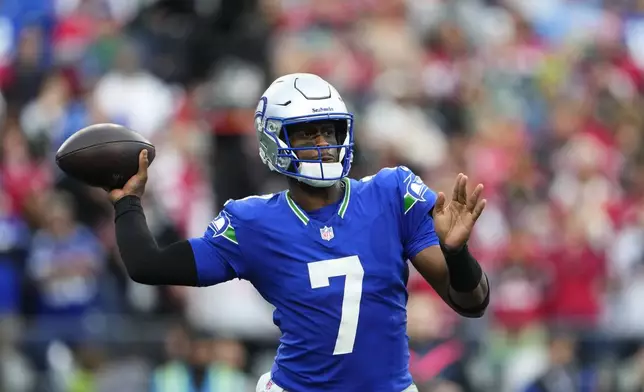 Seattle Seahawks quarterback Geno Smith throws during the first half of an NFL football game against the San Francisco 49ers, Thursday, Oct. 10, 2024, in Seattle. (AP Photo/Lindsey Wasson)