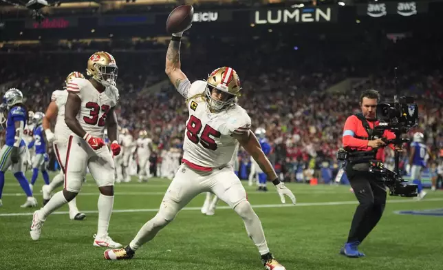 San Francisco 49ers' George Kittle (85) reacts after a touchdown against the Seattle Seahawks, Thursday, Oct. 10, 2024, in Seattle. (AP Photo/Lindsey Wasson)