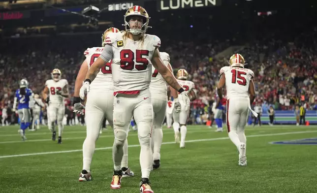 San Francisco 49ers' George Kittle (85) reacts after a touchdown against the Seattle Seahawks, Thursday, Oct. 10, 2024, in Seattle. (AP Photo/Lindsey Wasson)