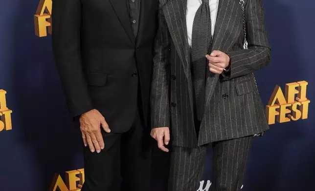 Tom Hanks, left, and Robin Wright arrive at the AFI Fest premiere of "Here" on Friday, Oct. 25, 2024, at TCL Chinese Theatre in Los Angeles. (AP Photo/Chris Pizzello)