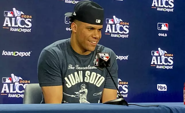 Juan Soto speaks in the Yankee Stadium news conference room after hitting a go-ahead home run in a win over Cleveland in the AL Championship Series opener on Monday, Oct. 14, 2024, in New York. (AP Photo/Ron Blum)