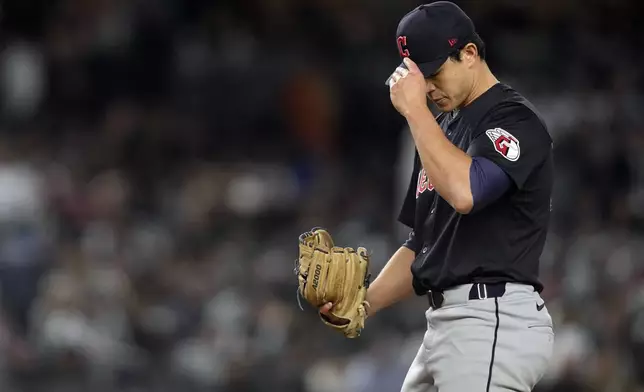 Cleveland Guardians relief pitcher Joey Cantillo adjusts his cap after walking New York Yankees' Gleyber Torres during the fourth inning in Game 1 of the baseball AL Championship Series Monday, Oct. 14, 2024, in New York. (AP Photo/Godofredo Vásquez)